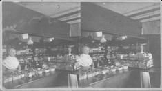 SA0009 - Mary Hazard is the person on the left. A store interior. Caption on the back along with an advertisement for the photographer., Winterthur Shaker Photograph and Post Card Collection 1851 to 1921c